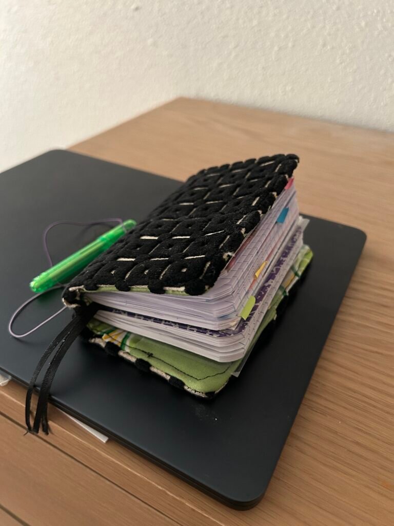 Fabric TN with 2 mini composition notebooks inside.