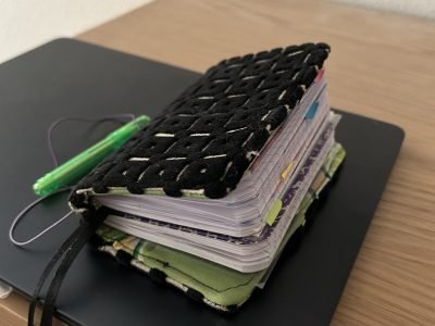 Fabric TN with 2 mini composition notebooks inside.